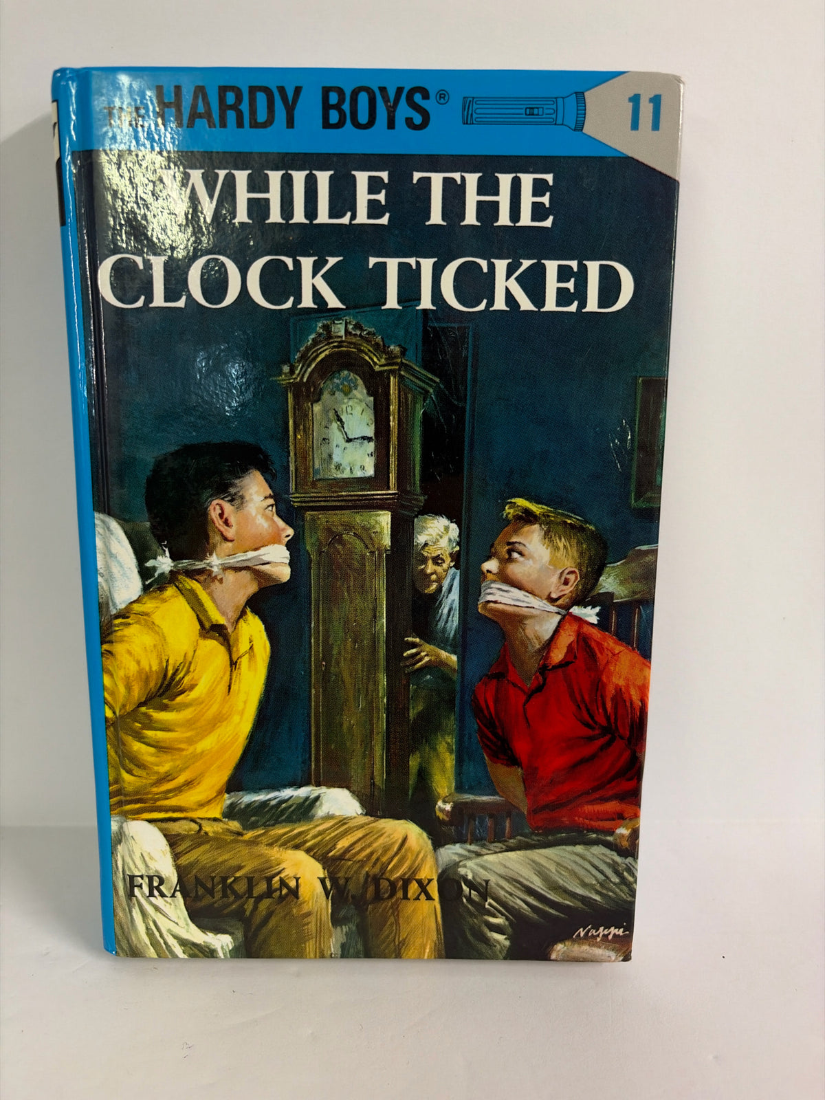 While the Clock Ticked Franklin W. Dixon Grosset & Dunlap Juvenile Books