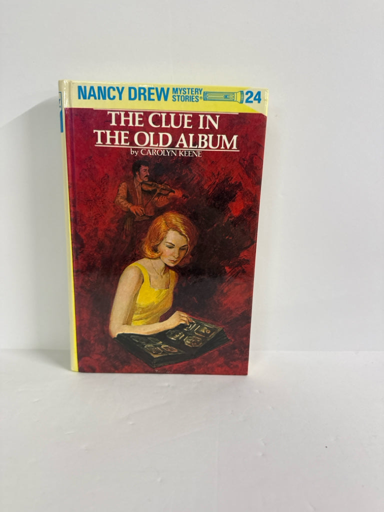 The Clue in the Old Album Carolyn Keene Grosset & Dunlap Juvenile Books